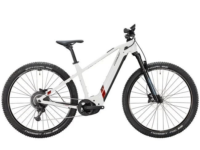 White mountain bike with thick tires and suspension fork
